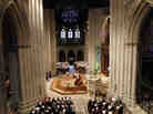 Members of the congregation stand at the Washington National Cathedral in Washington during the national memorial service for the first man to walk on the moon, Neil Armstrong.