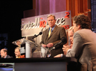 John Donvan of ABC News moderates an Intelligence Squared debate on the regulation of money in politics. John Donvan of ABC News moderates an Intelligence Squared debate on the regulation of money in politics.