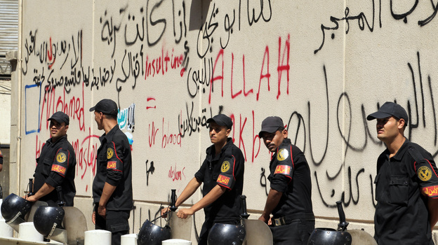 Security guards were deployed outside the graffiti-covered walls of the U.S. Embassy in Cairo, Egypt, which came under attack Tuesday.