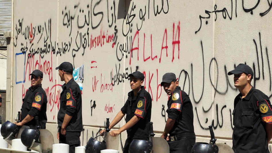 Security guards were deployed outside the graffiti-covered walls of the U.S. Embassy in Cairo, Egypt, which came under attack Tuesday.