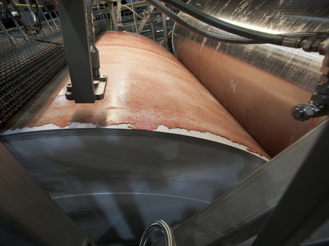 Lean, finely textured beef, dubbed "pink slime" by critics, is frozen on a large drum as part of its manufacturing process at the Beef Products Inc.'s plant in S. Sioux City, Neb. in March.