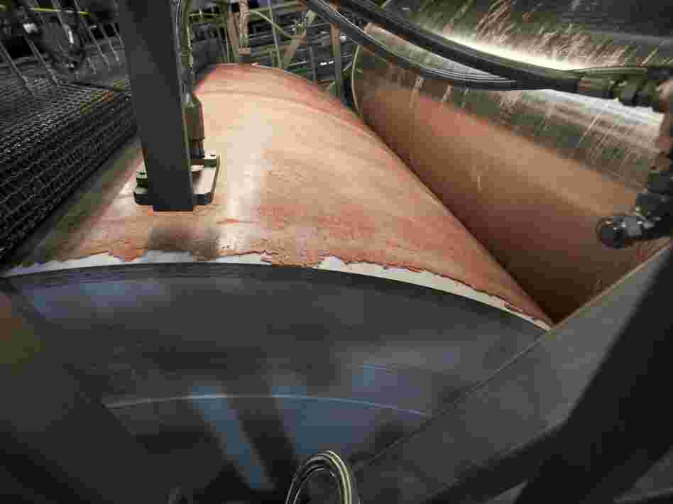 Lean, finely textured beef, dubbed "pink slime" by critics, is frozen on a large drum as part of its manufacturing process at the Beef Products Inc.'s plant in S. Sioux City, Neb. in March.