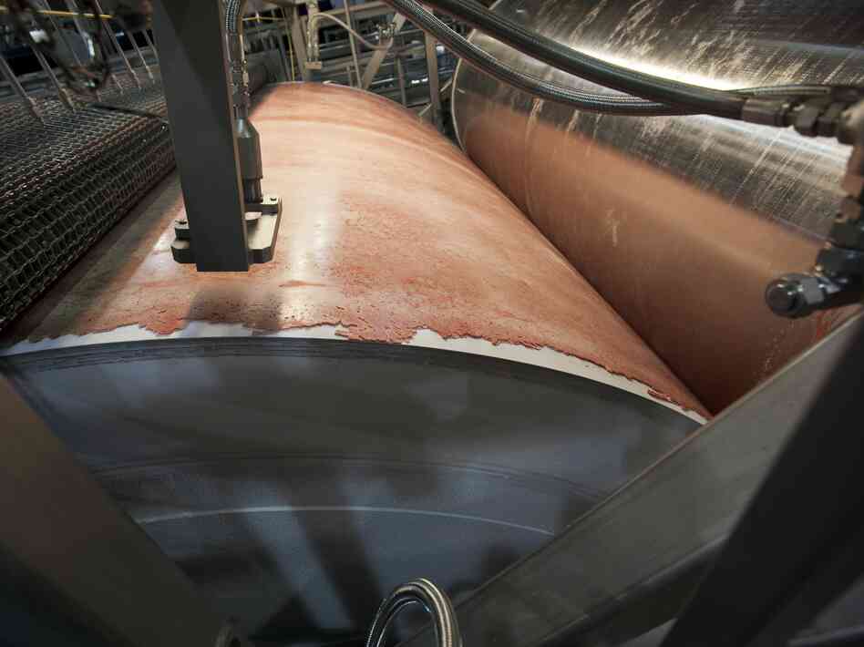 Lean, finely textured beef, dubbed "pink slime" by critics, is frozen on a large drum as part of its manufacturing process at the Beef Products Inc.'s plant in S. Sioux City, Neb. in March.