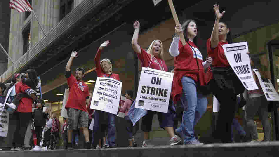 Chicago Teachers Union members picket the CPS headquarters in Chicago on Thursday, the fourth day of their strike. Chicago Teachers Union members picket the CPS headquarters in Chicago on Thursday, the fourth day of their strike.