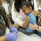 Nurse Fatima Guillen (left) gives 4-year-old Kimberly Magdeleno a whooping cough booster shot at a health clinic in Tacoma, Wash., in May. Nurse Fatima Guillen (left) gives 4-year-old Kimberly Magdeleno a whooping cough booster shot at a health clinic in Tacoma, Wash., in May.