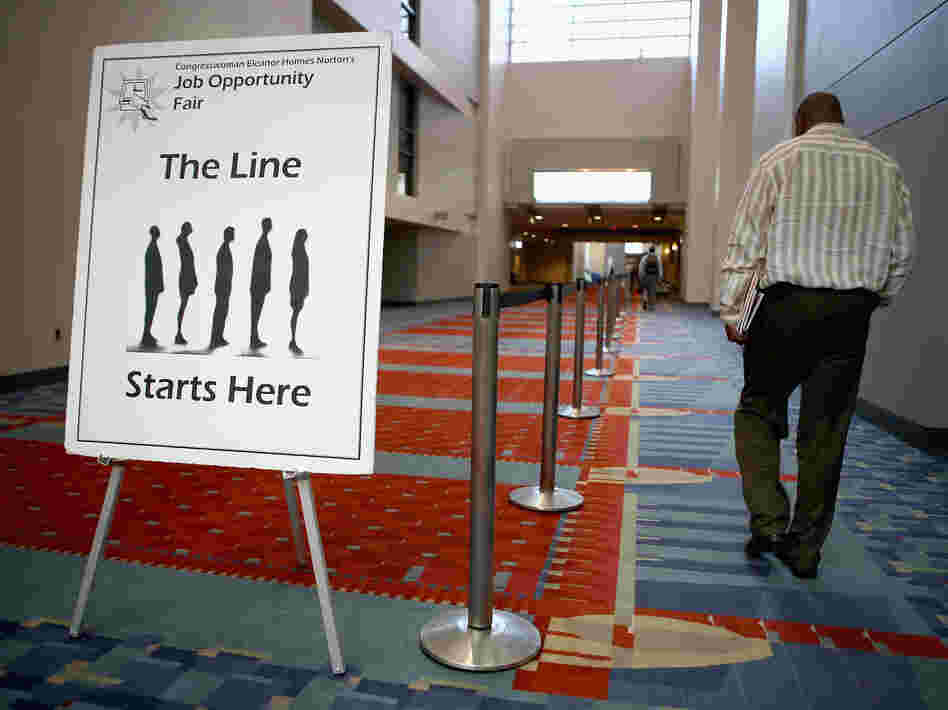 A job fair was held at the The Walter E. Washington Convention Center in Washington, D.C., last month. The U.S. unemployment rate declined in August in part because the number of "discouraged workers" climbed.