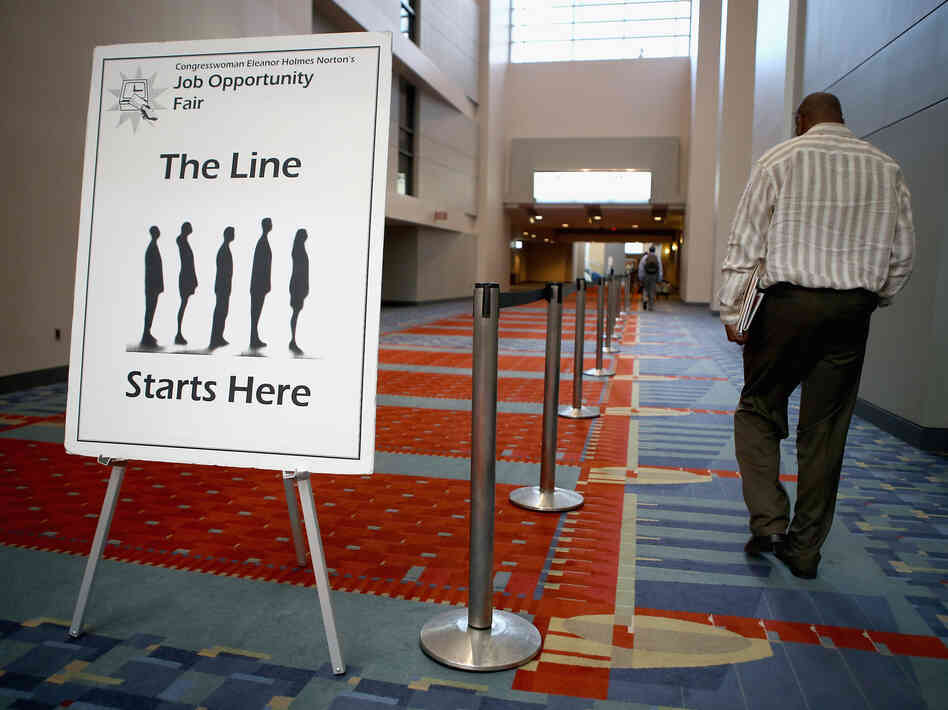 A job fair was held at the The Walter E. Washington Convention Center in Washington, D.C., last month. The U.S. unemployment rate declined in August in part because the number of "discouraged workers" climbed.