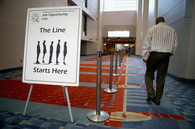 A job fair was held at the The Walter E. Washington Convention Center in Washington, D.C., last month. The U.S. unemployment rate declined in August in part because the number of "discouraged workers" climbed.