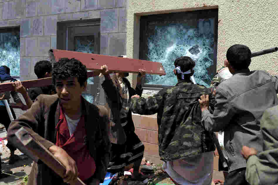 A mob in Yemen attacks the U.S. Embassy during a protest against a film they say insults the Prophet Muhammad, in the capital, Sanaa, on Thursday.