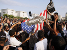 Protesters outside the U.S. embassy in Tunis burn an American flag bearing a portrait of Marilyn Monroe during a demonstration Wednesday against a film deemed offensive to Islam. Protesters outside the U.S. embassy in Tunis burn an American flag bearing a portrait of Marilyn Monroe during a demonstration Wednesday against a film deemed offensive to Islam.