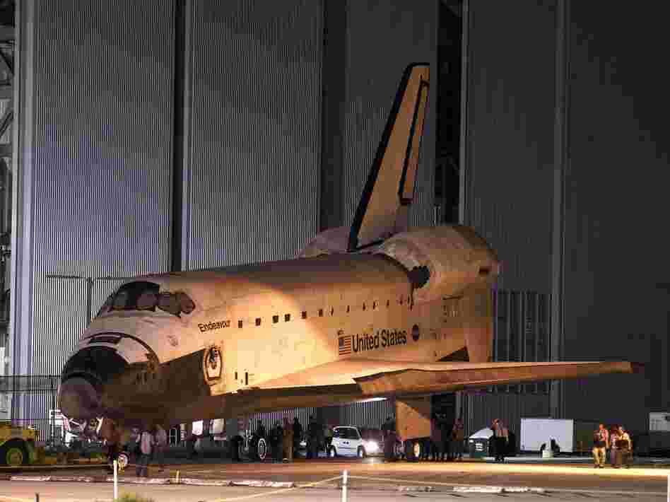 Space shuttle Endeavour is towed to the Kennedy Space Center landing facility in Cape Canaveral, Fla., on Friday.
