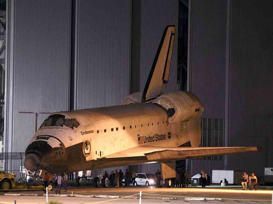 Space shuttle Endeavour is towed to the Kennedy Space Center landing facility in Cape Canaveral, Fla., on Friday.