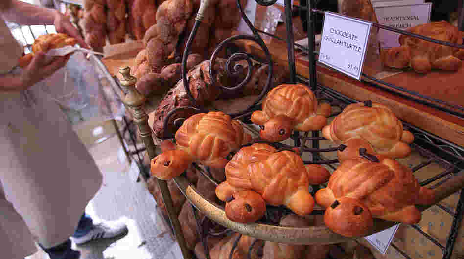 The traditional challah for the upcoming Jewish holiday, Rosh Hashana, is round. But as this bakery demonstrates, other shapes offer symbolic meanings. The traditional challah for the upcoming Jewish holiday, Rosh Hashana, is round. But as this bakery demonstrates, other shapes offer symbolic meanings.