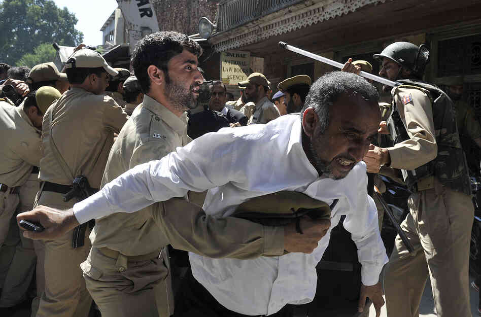 Police try to stop Kashmiri lawyers during a demonstration in Srinagar, India. The controversial low budget film portrays Muslims as immoral and gratuitous sparked fury in Libya, where four Americans including the ambassador were killed on Tuesday when a mob attacked the U.S. consulate in Benghazi.