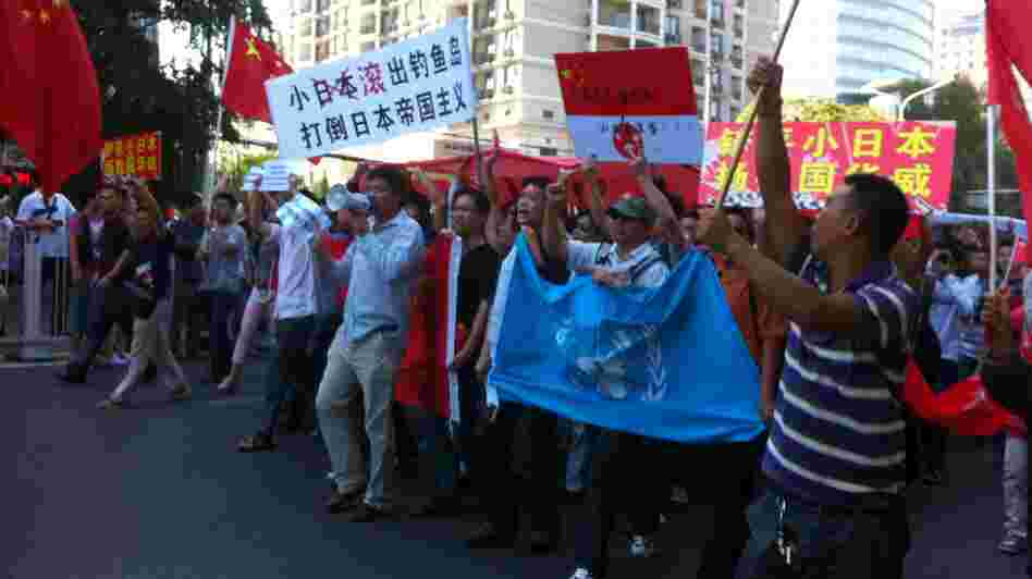 Protesters march outside the Japanese Embassy in Beijing on Saturday. Tension escalated, sometimes to violence, in cities across China after Japan bought the disputed islands from a private Japanese owner.