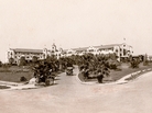 The Beverly Hills Hotel as it looked when it opened in 1912. The bleak landscape would eventually be replaced by lush tropical foliage, and after the depression, the white Spanish Mission-style hotel would be painted its now-famous pink. The Beverly Hills Hotel as it looked when it opened in 1912. The bleak landscape would eventually be replaced by lush tropical foliage, and after the depression, the white Spanish Mission-style hotel would be painted its now-famous pink.