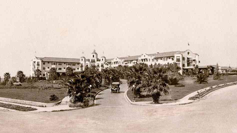 The Beverly Hills Hotel as it looked when it opened in 1912. The bleak landscape would eventually be replaced by lush tropical foliage, and after the depression, the white Spanish Mission-style hotel would be painted its now-famous pink.