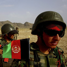 Afghan soldiers (right) patrol with U.S. troops in the Panjwai district of southern Afghanistan in May. The two armies have been working together for years, but Afghan attacks against U.S. and NATO forces have been rising recently.