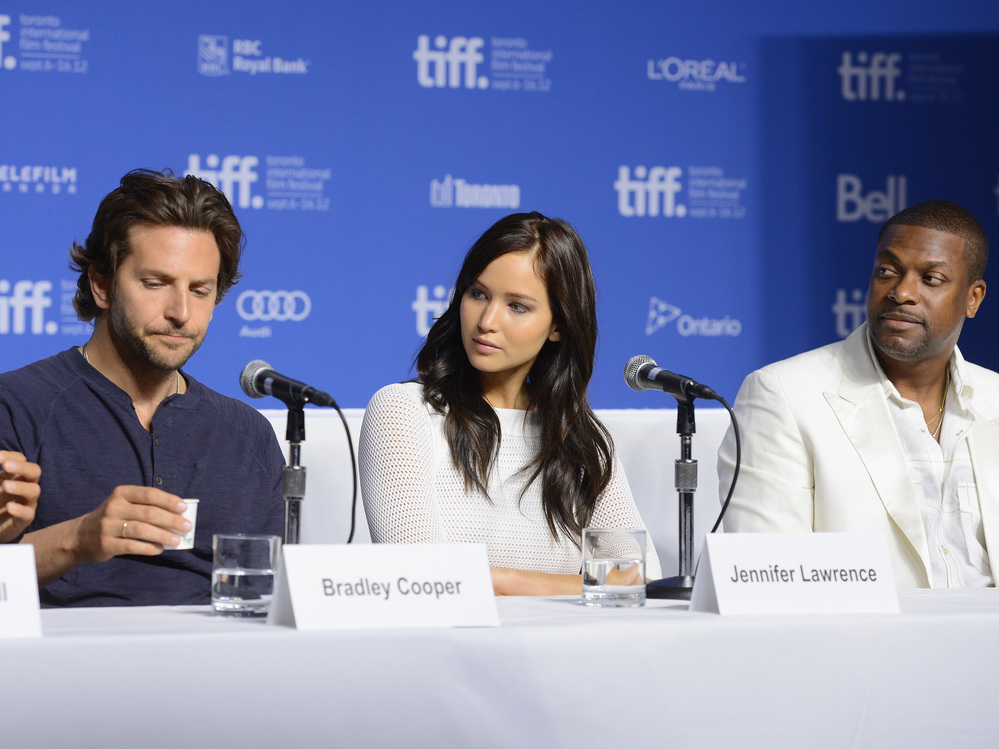 Actors Bradley Cooper (left), Jennifer Lawrence and Chris Tucker speak onstage at Silver Linings Playbook press conference Sept. 9 during the 2012 Toronto International Film Festival.