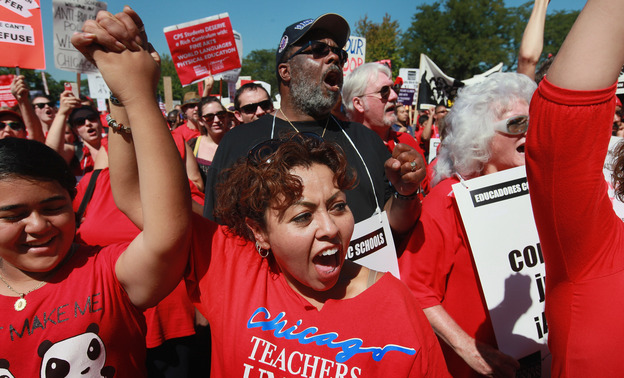 Striking Chicago teachers and their supporters attend a rally at Union Park Saturday in Chicago.