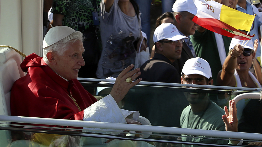 Pope Benedict XVI waves to Lebanese faithful upon his arrival to hold a mass on the waterfront in downtown Beirut on Sunday.