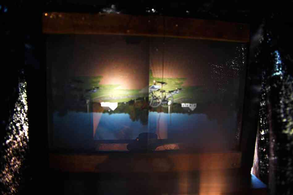 Here's what you see when you go under that little black cloth. Naturally, the view is in color — though at first it's a bit surprising. You can see how the camera's twin lenses project two identical images. But it takes some getting used to: The images on the focus plate are upside down and backward.