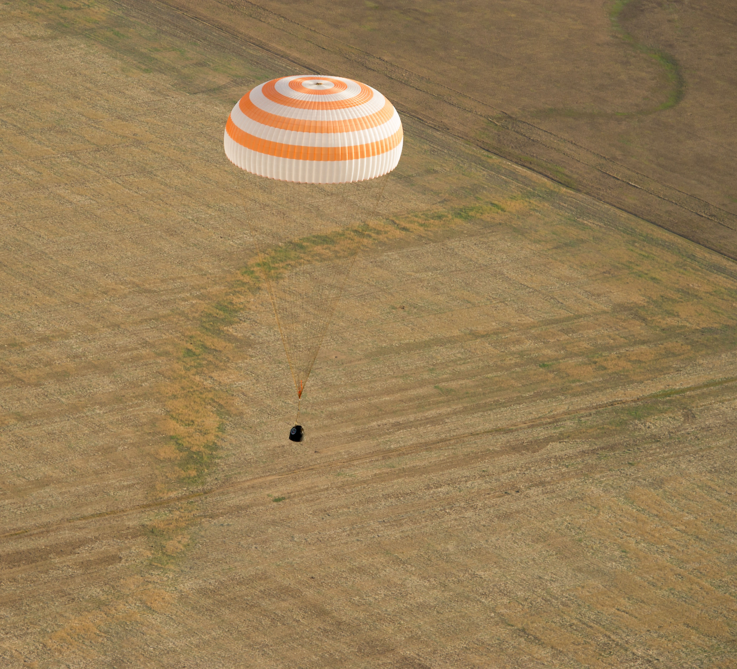 The Soyuz capsule floats as it brings Commander Gennady Padalka of Russia, NASA Flight Engineer Joe Acaba and Russian Flight Engineer Sergei Revin to a landing area near the town of Arkalyk, Kazakhstan. When it detached from the space station, the capsule was over Kenya.