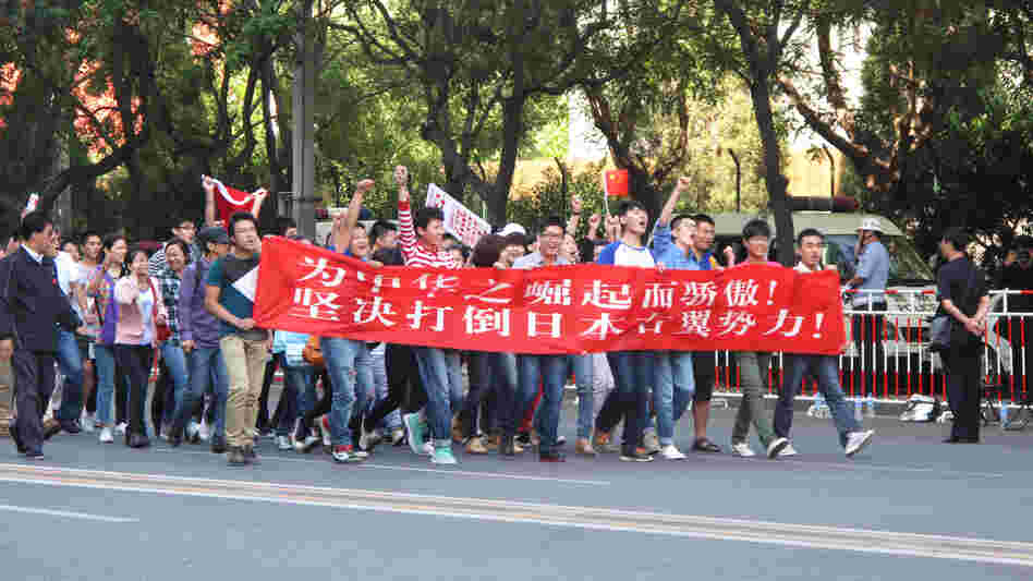 Protesters marched in front of the Japanese Embassy in Beijing today. They carried a banner declaring: "We are proud of China's rise. We resolutely oppose Japan's rightist forces." Protesters marched in front of the Japanese Embassy in Beijing today. They carried a banner declaring: "We are proud of China's rise. We resolutely oppose Japan's rightist forces."