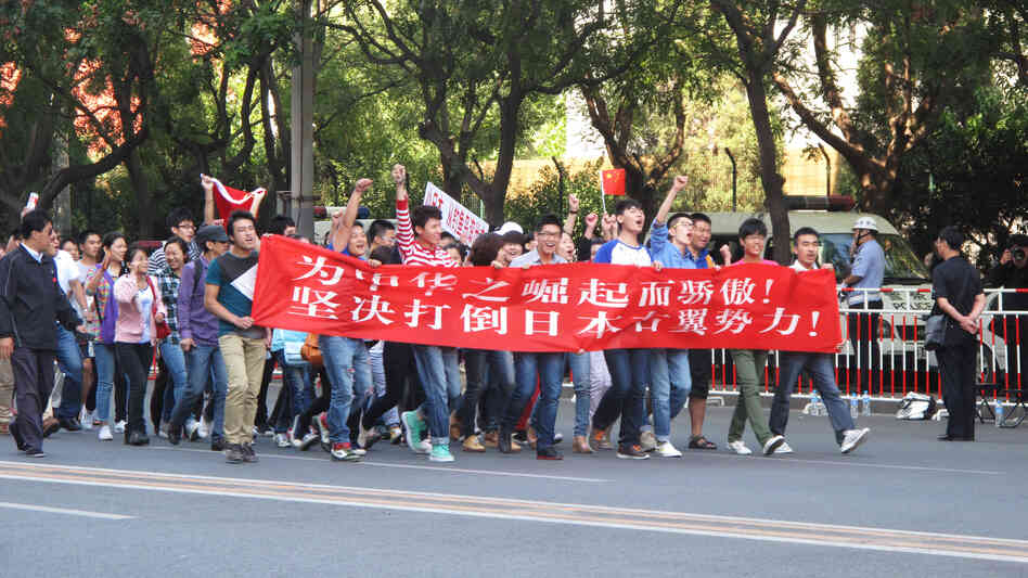 Protesters marched in front of the Japanese Embassy in Beijing today. They carried a banner declaring: "We are proud of China's rise. We resolutely oppose Japan's rightist forces." Protesters marched in front of the Japanese Embassy in Beijing today. They carried a banner declaring: "We are proud of China's rise. We resolutely oppose Japan's rightist forces."