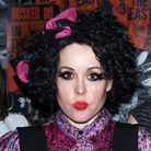 The Corin Tucker Band, from left: Sarah Lund, Corin Tucker, Seth Lorinczi and Mike Clark — dressed up as X-Ray Spex in the video for "Neskowin."