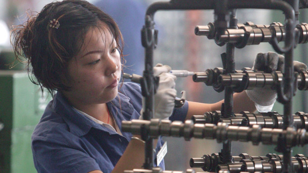 A worker inspects auto parts at a factory in Chengdu, China. (2005 file photo.) (Getty Images)