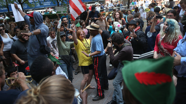 Protesters dance in Zuccotti Park on the one-year anniversary of the Occupy Wall Street movement.