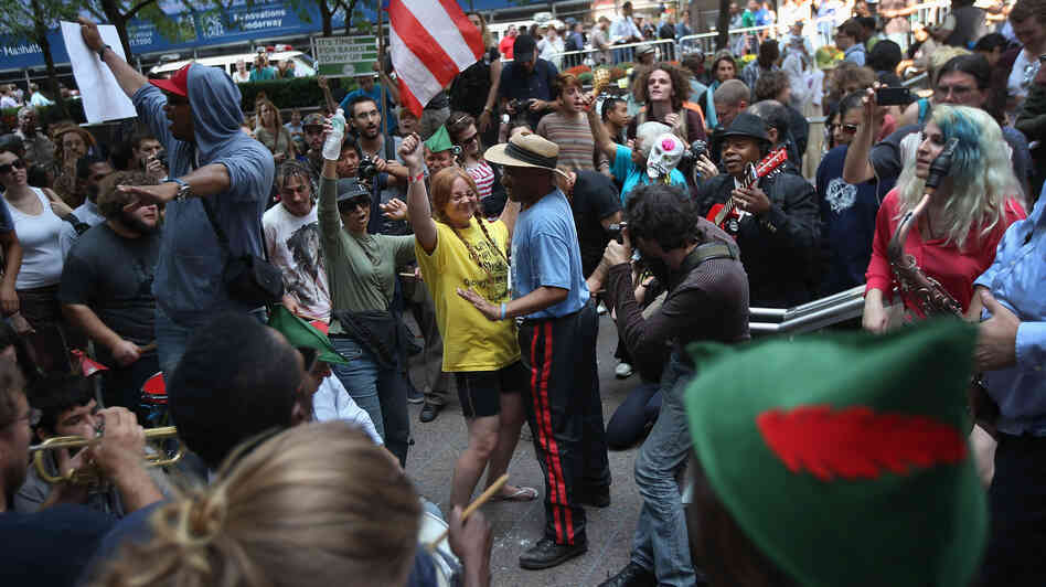 Protesters dance in Zuccotti Park on the one-year anniversary of the Occupy Wall Street movement.