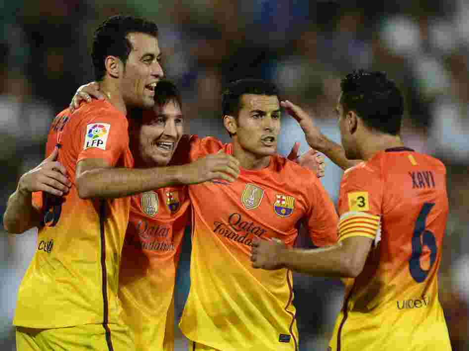Lionel Messi (second from left) and some of his Barcelona teammates during a match last weekend.