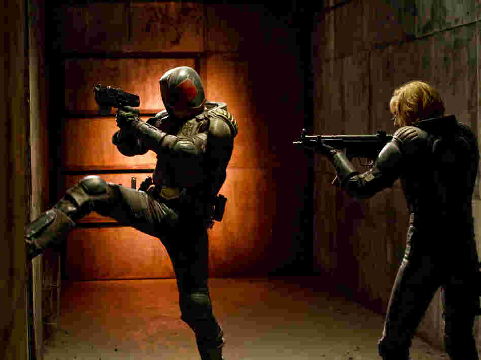 Judge Dredd and his protege, Anderson (Olivia Thirlby), fight a drug lord in a post-apocalyptic slum.