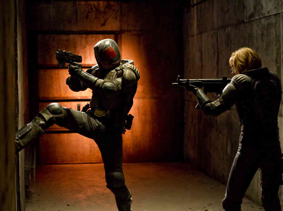 Judge Dredd and his protege, Anderson (Olivia Thirlby), fight a drug lord in a post-apocalyptic slum.