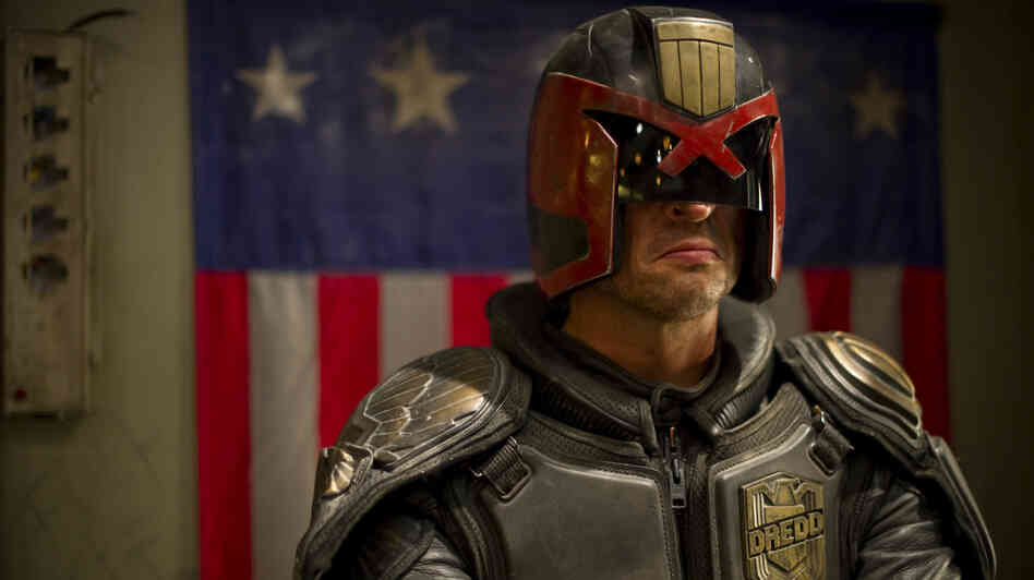 Judge Dredd (Karl Urban) is responsible for both convicting and punishing the criminals of Mega-City One. Judge Dredd (Karl Urban) is responsible for both convicting and punishing the criminals of Mega-City One.
