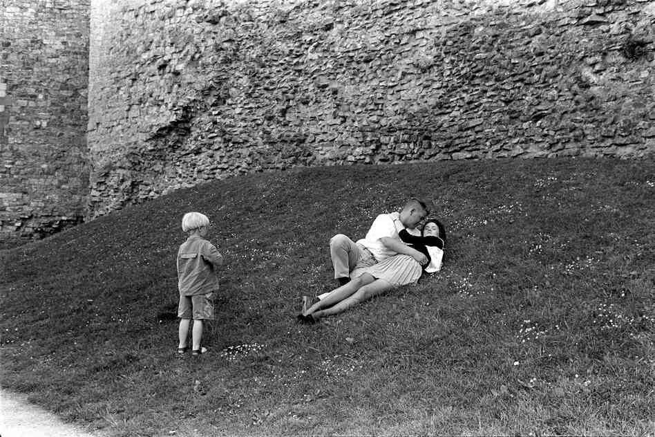 Couple embracing by castle, Cardiff, Wales, 1993