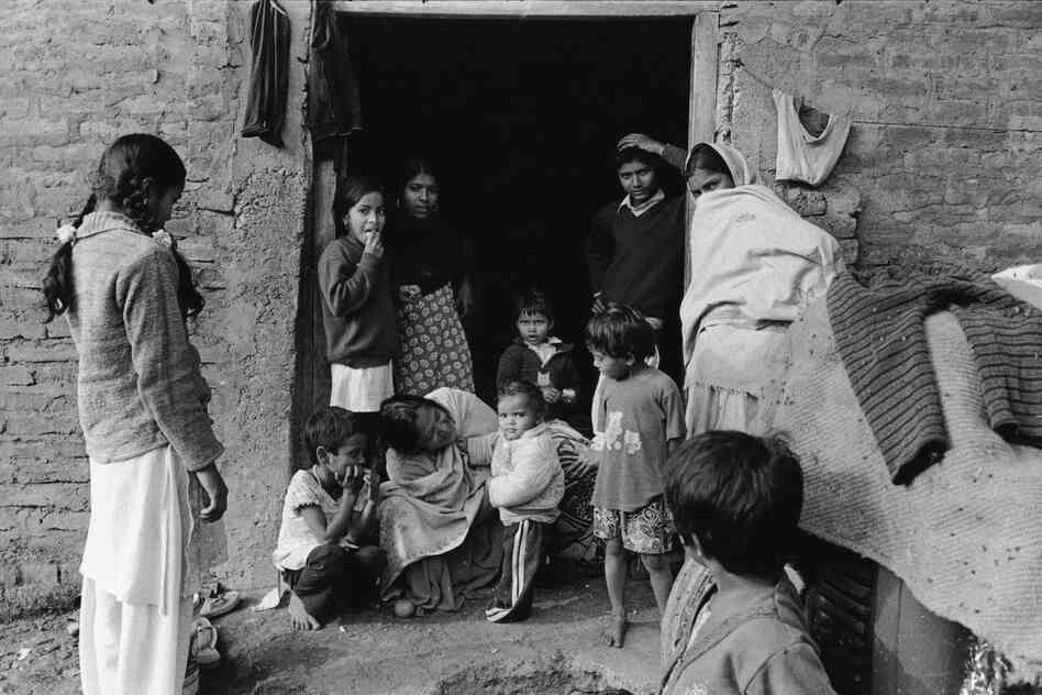 Family by door, Lumbini, Nepal, 2012