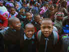 Students at Frazier International Magnet School wait outside before the start of school on Wednesday in Chicago.