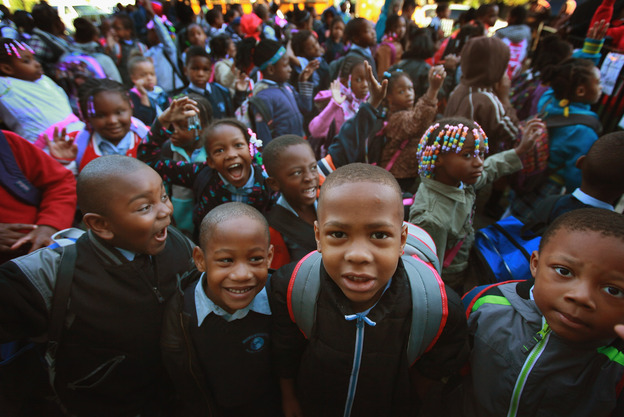 Students at Frazier International Magnet School wait outside before the start of school on Wednesday in Chicago.