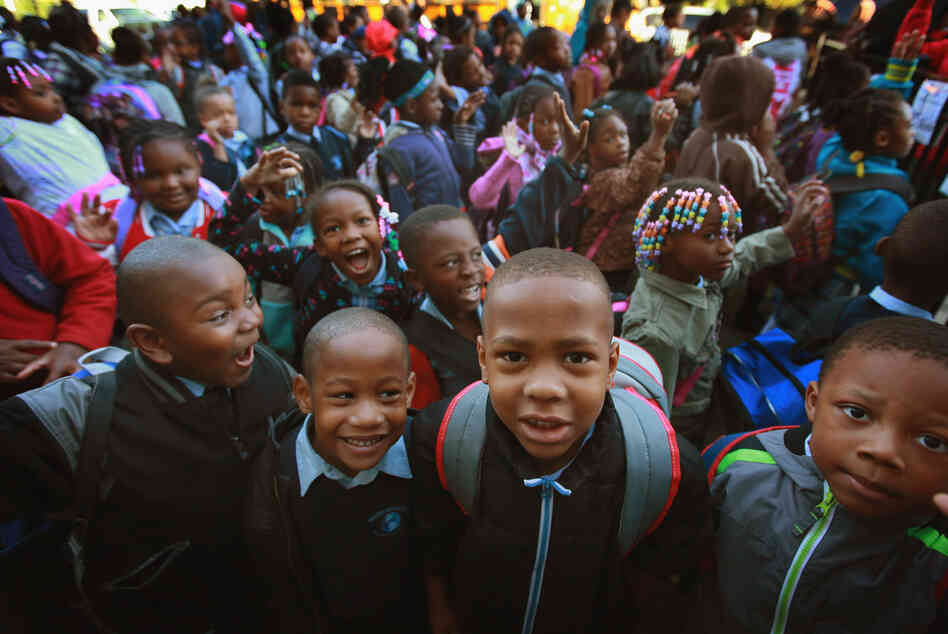 Students at Frazier International Magnet School wait outside before the start of school on Wednesday in Chicago.