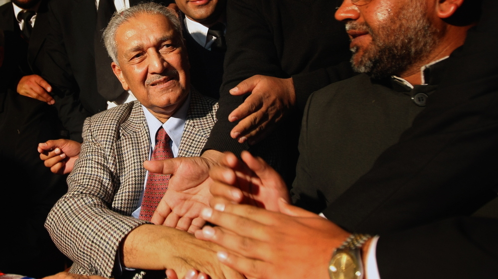 Abdul Qadeer Khan, regarded as the father of Pakistan's nuclear bomb, shakes hands with supporters at the Rawalpindi High Court in 2010. The controversial Khan, who sold nuclear secrets to Iran and North Korea, is now entering politics.