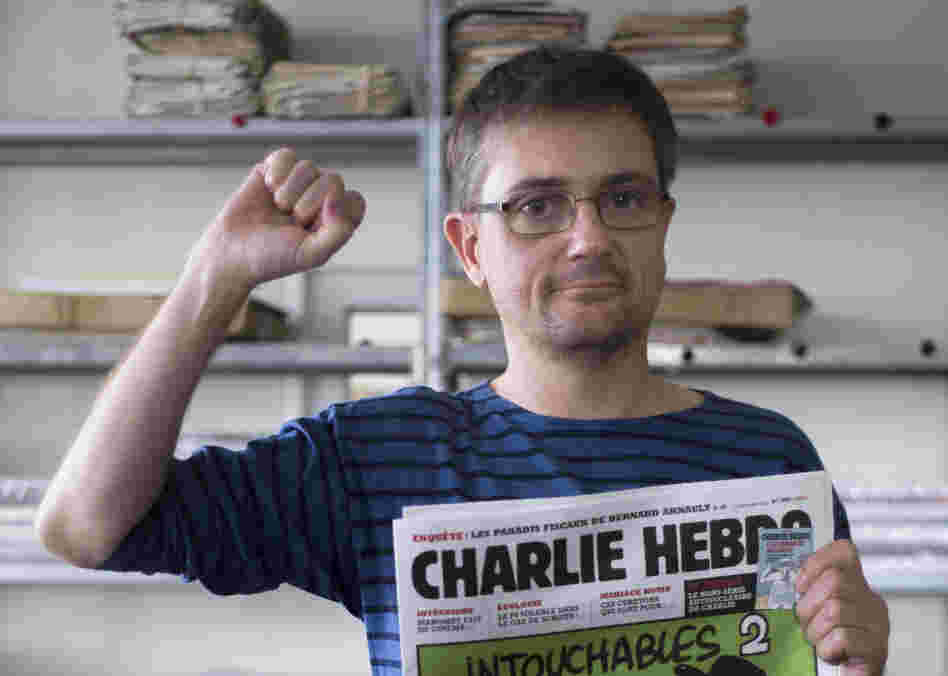 At the offices of the French satirical weekly Charlie Hebdo earlier today, publisher/editor Stephane Charbonnier ("Charb") struck a defiant pose.