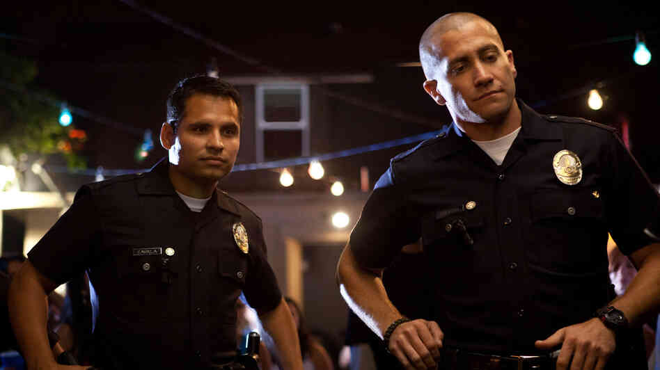 Officers Mike Zavala (Michael Peña) and Brian Taylor (Jake Gyllenhaal) tangle with a vicious drug cartel in End of Watch. Officers Mike Zavala (Michael Peña) and Brian Taylor (Jake Gyllenhaal) tangle with a vicious drug cartel in End of Watch.