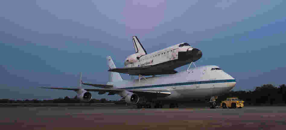 Space shuttle Endeavour, attached to a 747, on the tarmac at the Kennedy Space Center in Florida.