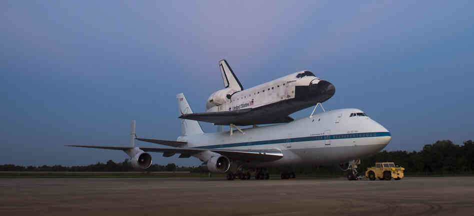 Space shuttle Endeavour, attached to a 747, on the tarmac at the Kennedy Space Center in Florida.