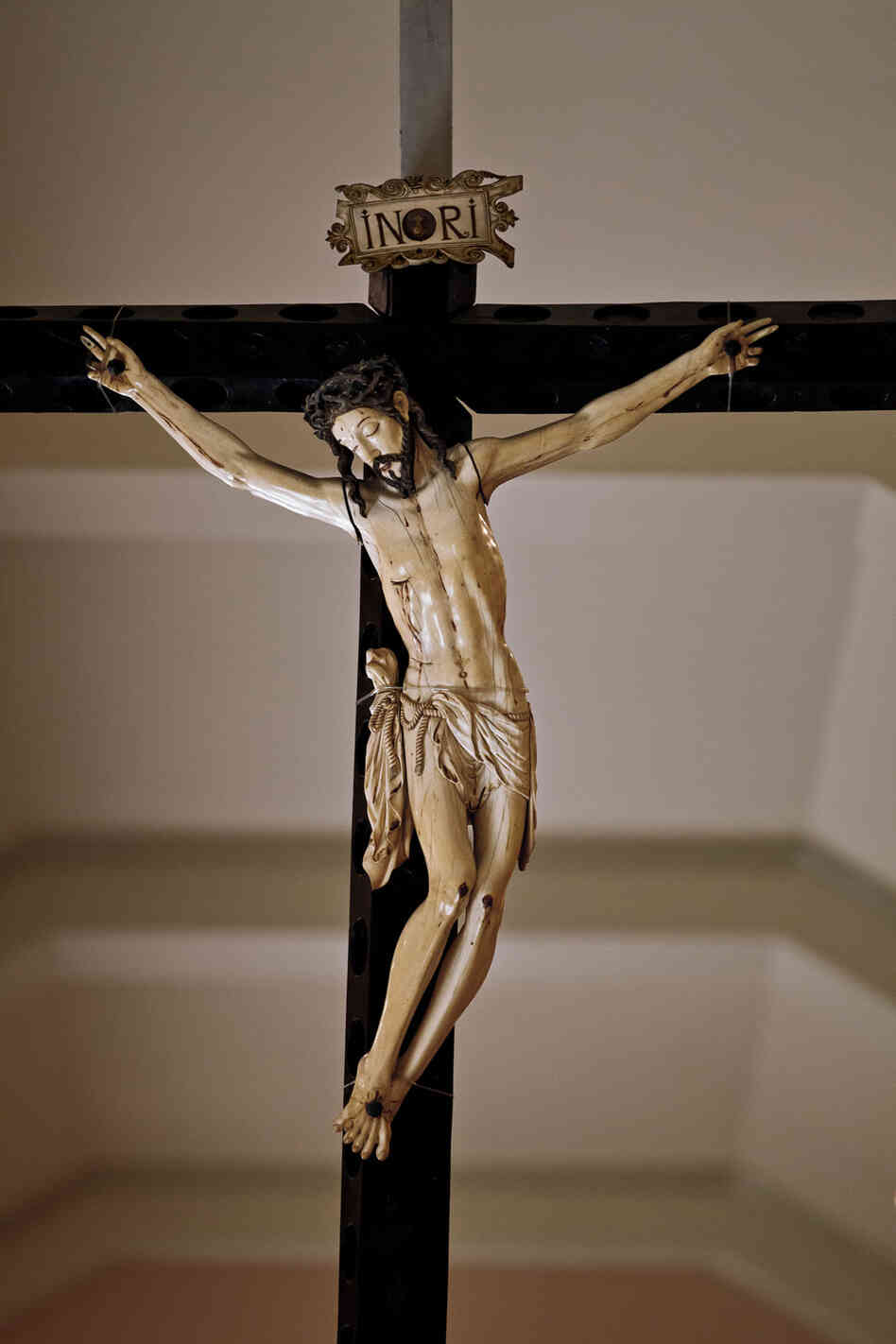 "The largest ivory crucifix in the Philippines hangs in a museum in Manila. The body of Christ, 30 inches long, is carved from a single tusk. The piece dates to the early 1600s, when Spanish galleons began bringing Asian ivory craftsmanship to Spain and the New World."