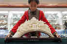 "A sculpture like this can take a master carver years to produce. Front and center are the popular Taoist gods Shou, Lu and Fu — symbols of long life, money, and luck. 'We hope — no, we insist — we can continue to protect these skills,' says Wang Shan, secretary-general of the China Arts and Crafts Association." "A sculpture like this can take a master carver years to produce. Front and center are the popular Taoist gods Shou, Lu and Fu — symbols of long life, money, and luck. 'We hope — no, we insist — we can continue to protect these skills,' says Wang Shan, secretary-general of the China Arts and Crafts Association."