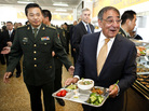 U.S. Defense Secretary Leon Panetta has lunch with engineering cadets at the Chinese military academy in Beijing on Wednesday. Just before Panetta's arrival for talks with top leaders, China released photos of a new stealth fighter under development. U.S. Defense Secretary Leon Panetta has lunch with engineering cadets at the Chinese military academy in Beijing on Wednesday. Just before Panetta's arrival for talks with top leaders, China released photos of a new stealth fighter under development.